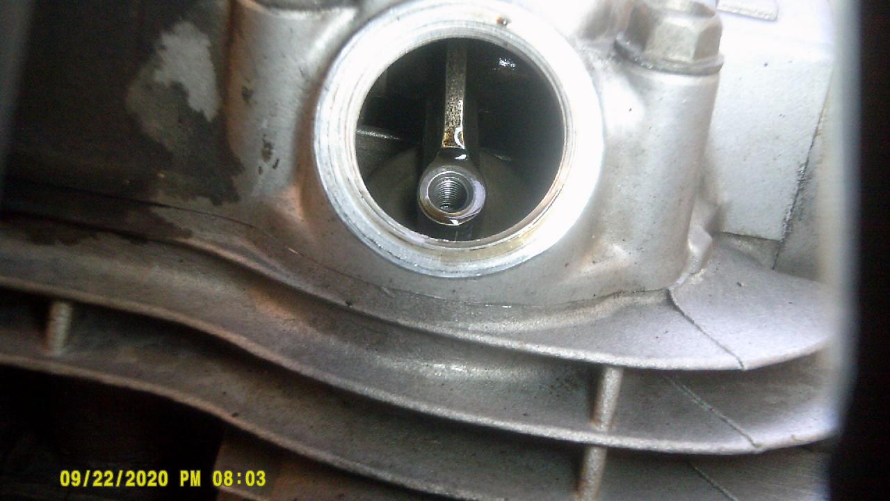 Exhaust side of valve, no screw, or nut.