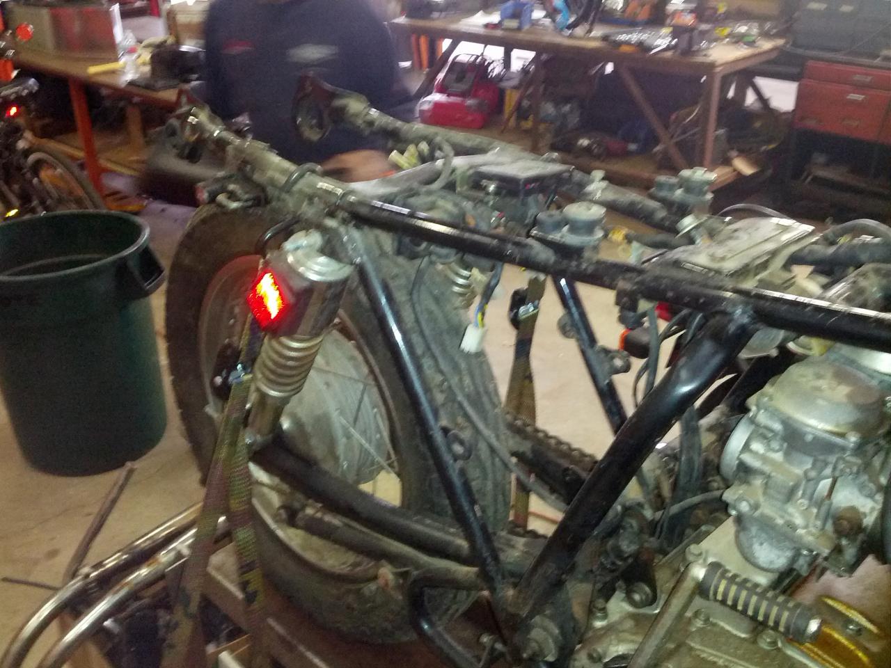 Stripped to frame engine and harness.Tom has started moddin the framework