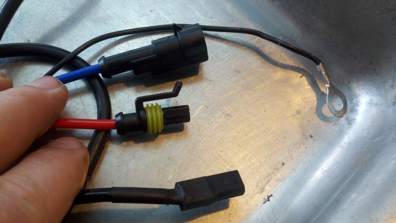 The three connectors & ground wire required for one bi-xenon bulb.
