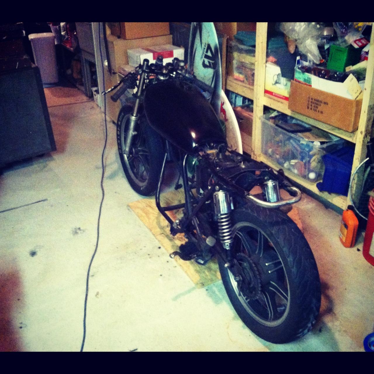 welded frame.
clip on bars.
custom fab'd seat from rolled steel.
bondo/painted tank.
lowered forks.
removed; gauges, fenders, stock headlamp/tail