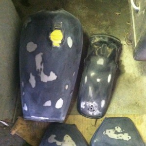 Tank, rear fender, and side covers sanded and ready for primer then paint.