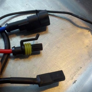The three connectors & ground wire required for one bi-xenon bulb.